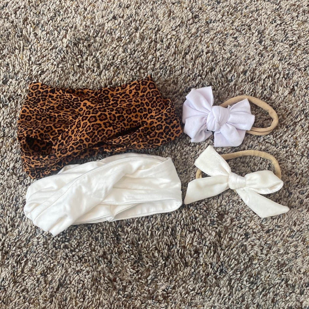 4 newborn hair pieces.